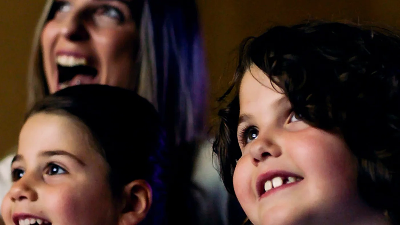 Children and a parent in the image Noah's Ark Children's Hospice used to announce it had reached £1 million